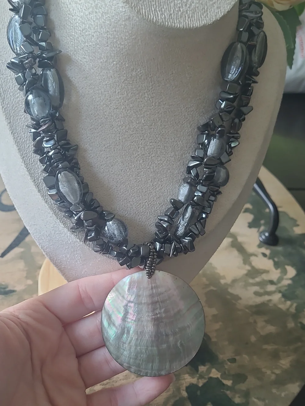 Multi-Strand Black Bead Necklace with Large Round Shell  Pendant